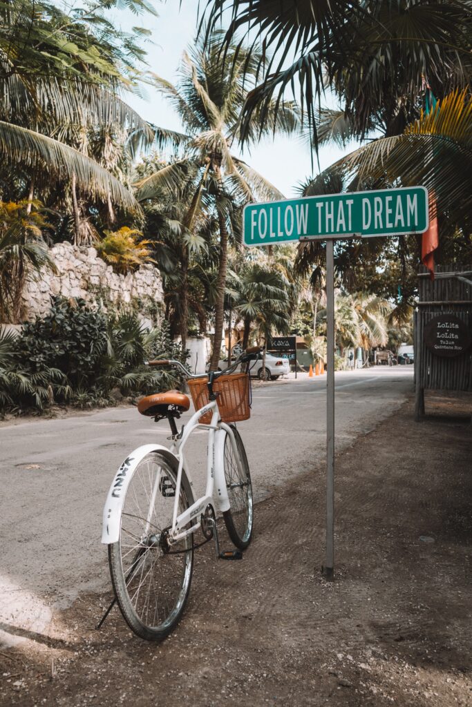 a bicycle in a street in tulum, mexico